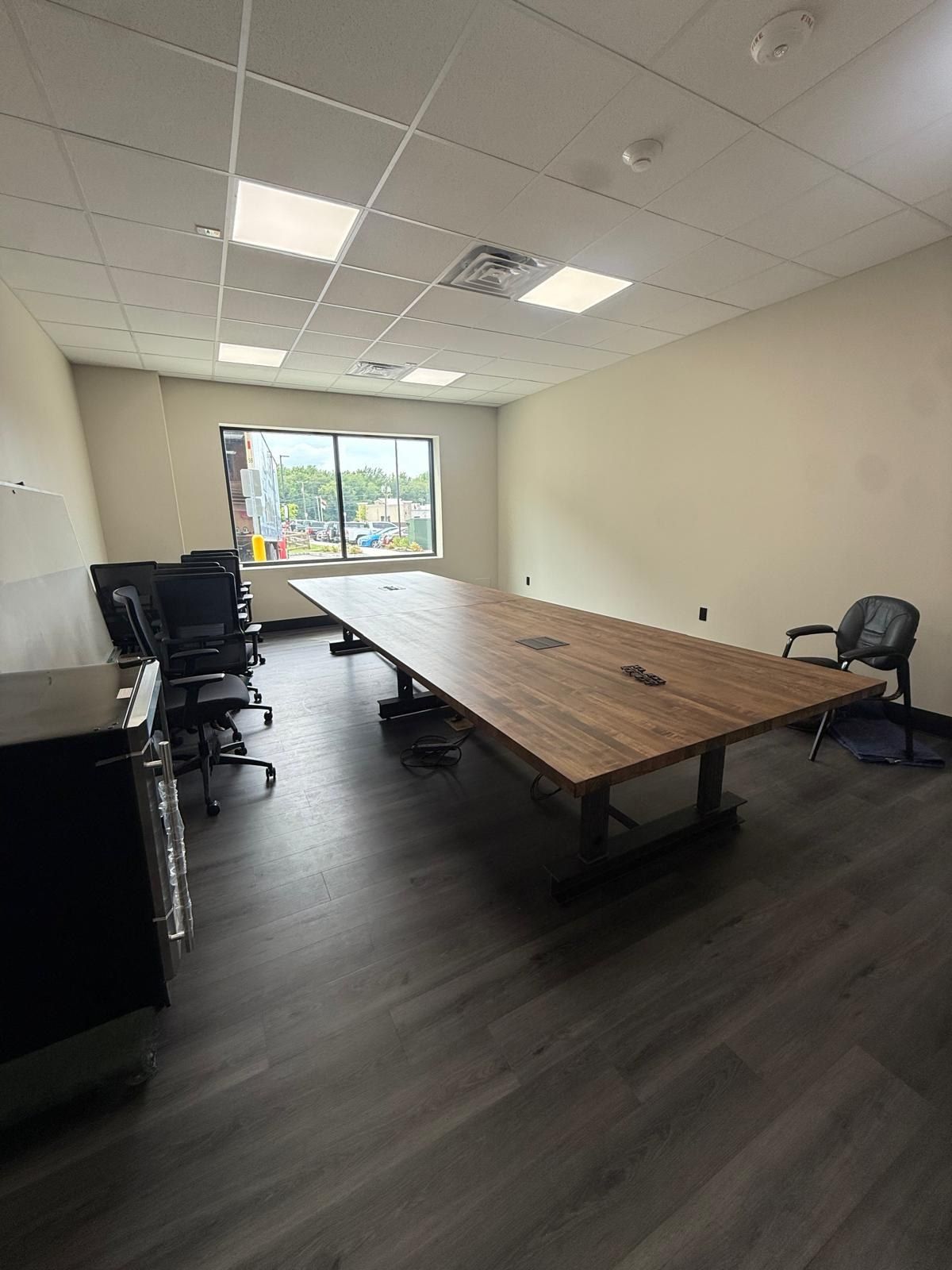 Completed meeting room with conference table and chairs