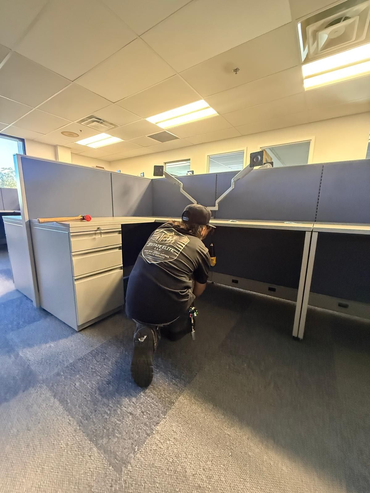 Team member installing workstation components
