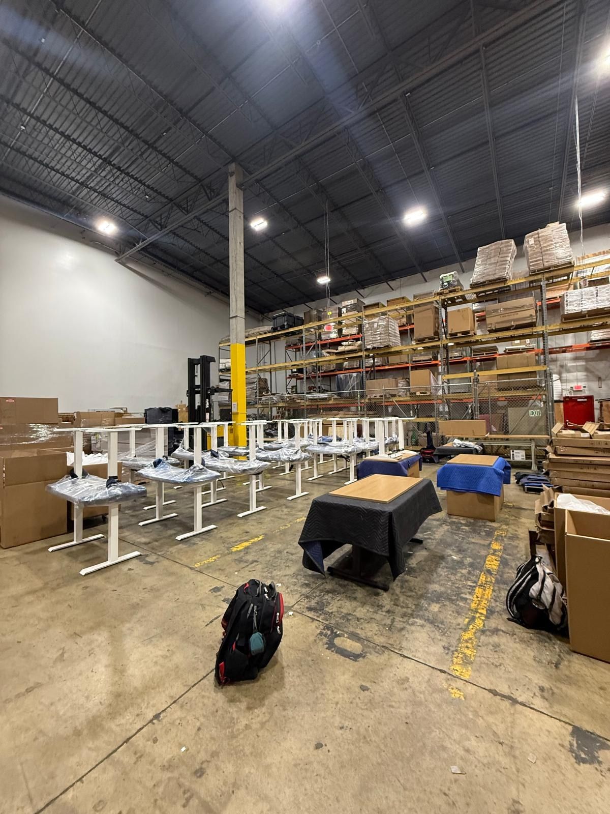 Furniture staged for delivery at a client-designated location