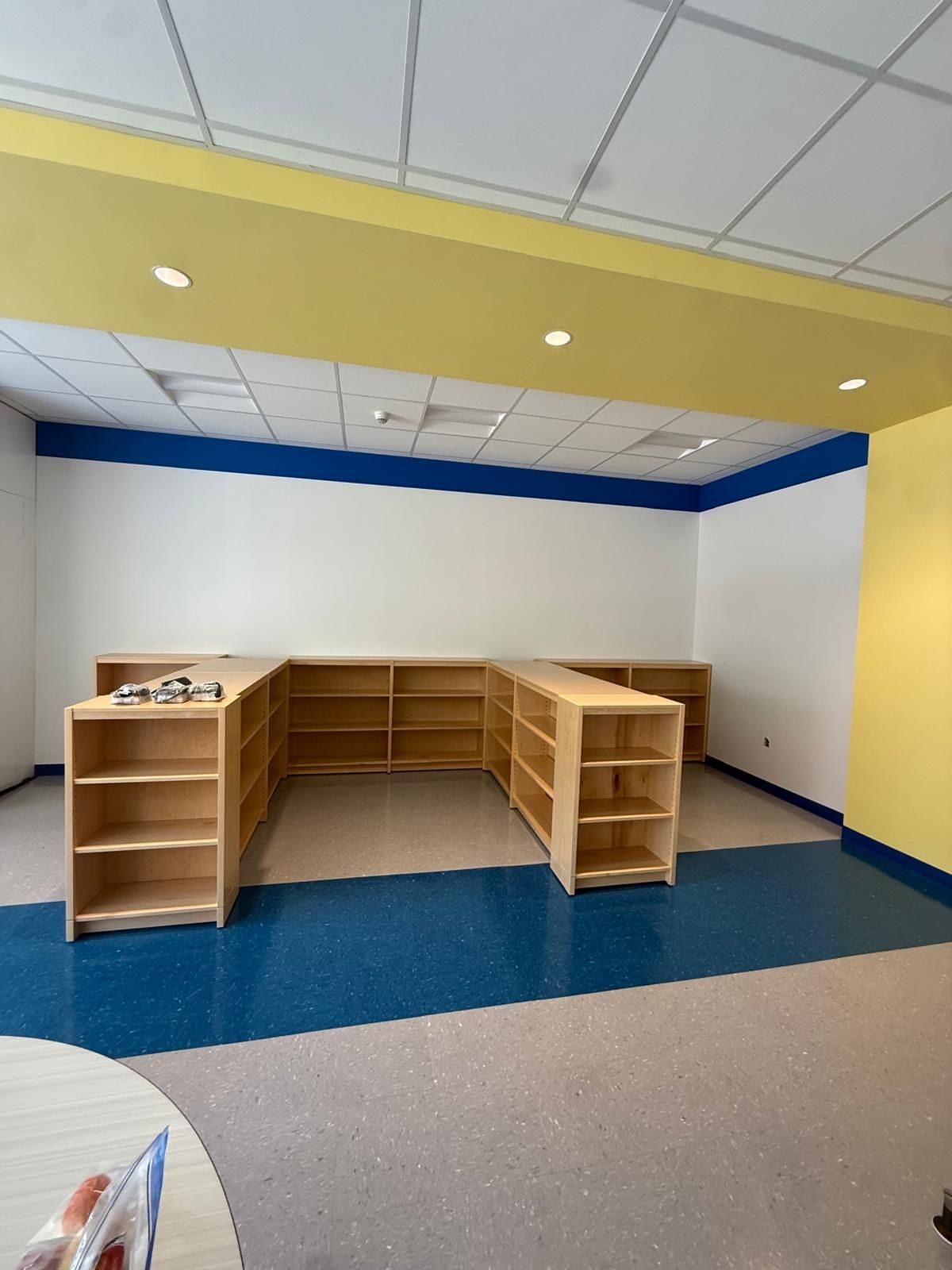 Installed storage shelving in a classroom-style space