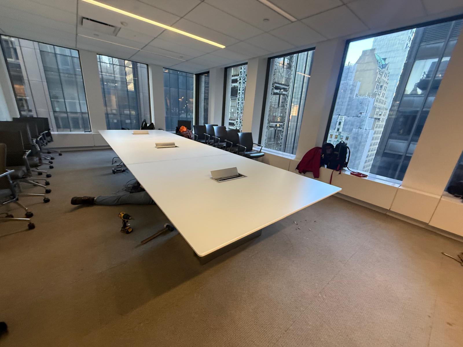 Conference table installation in progress