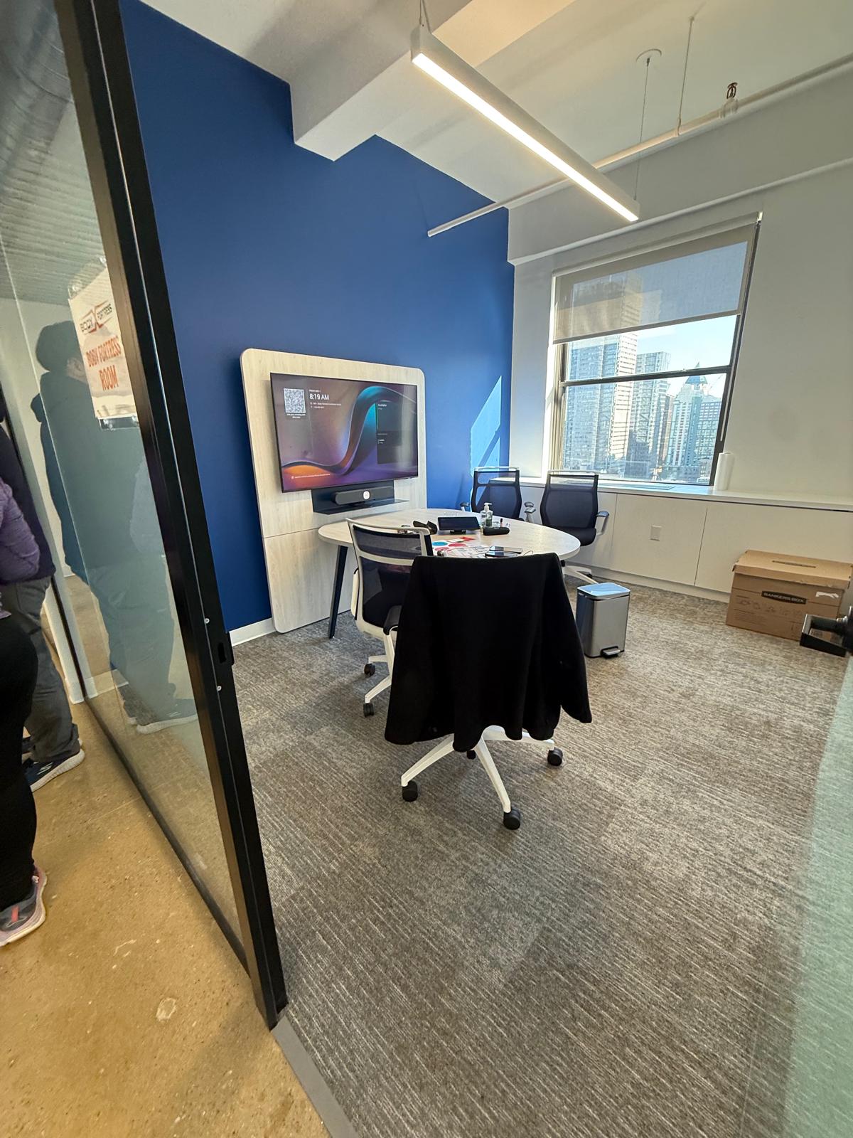 Finished meeting room with blue accent wall